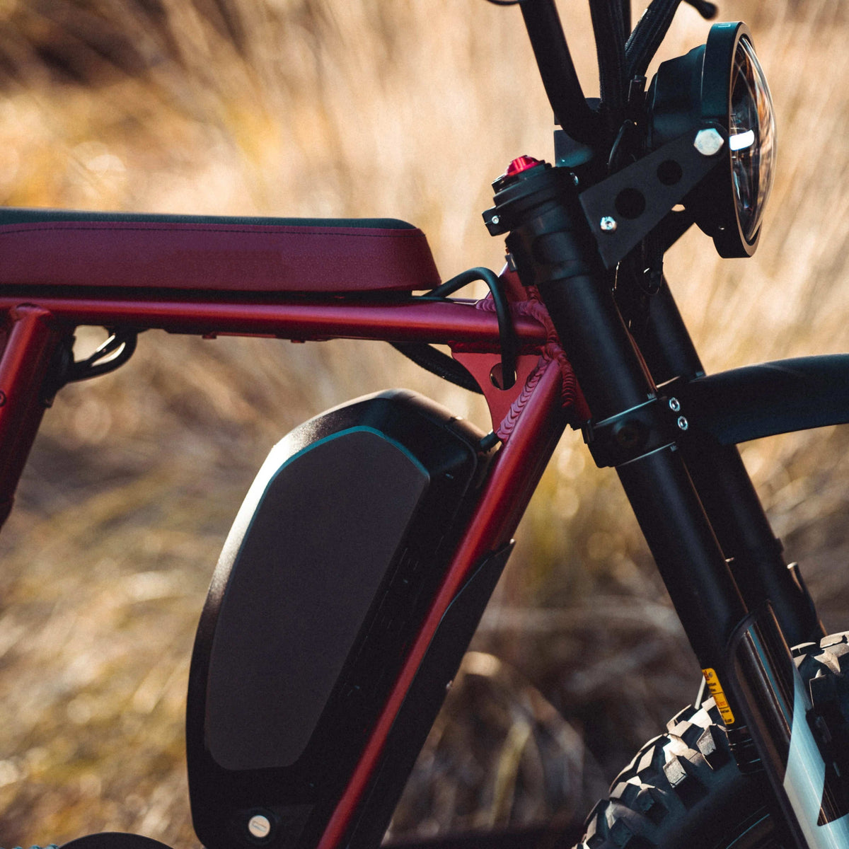 Super73 battery placement moved to front of frame on red bike