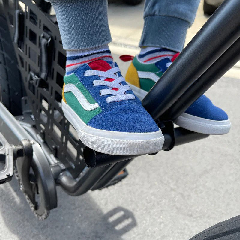Child using the foot peg on a Super73 eBike