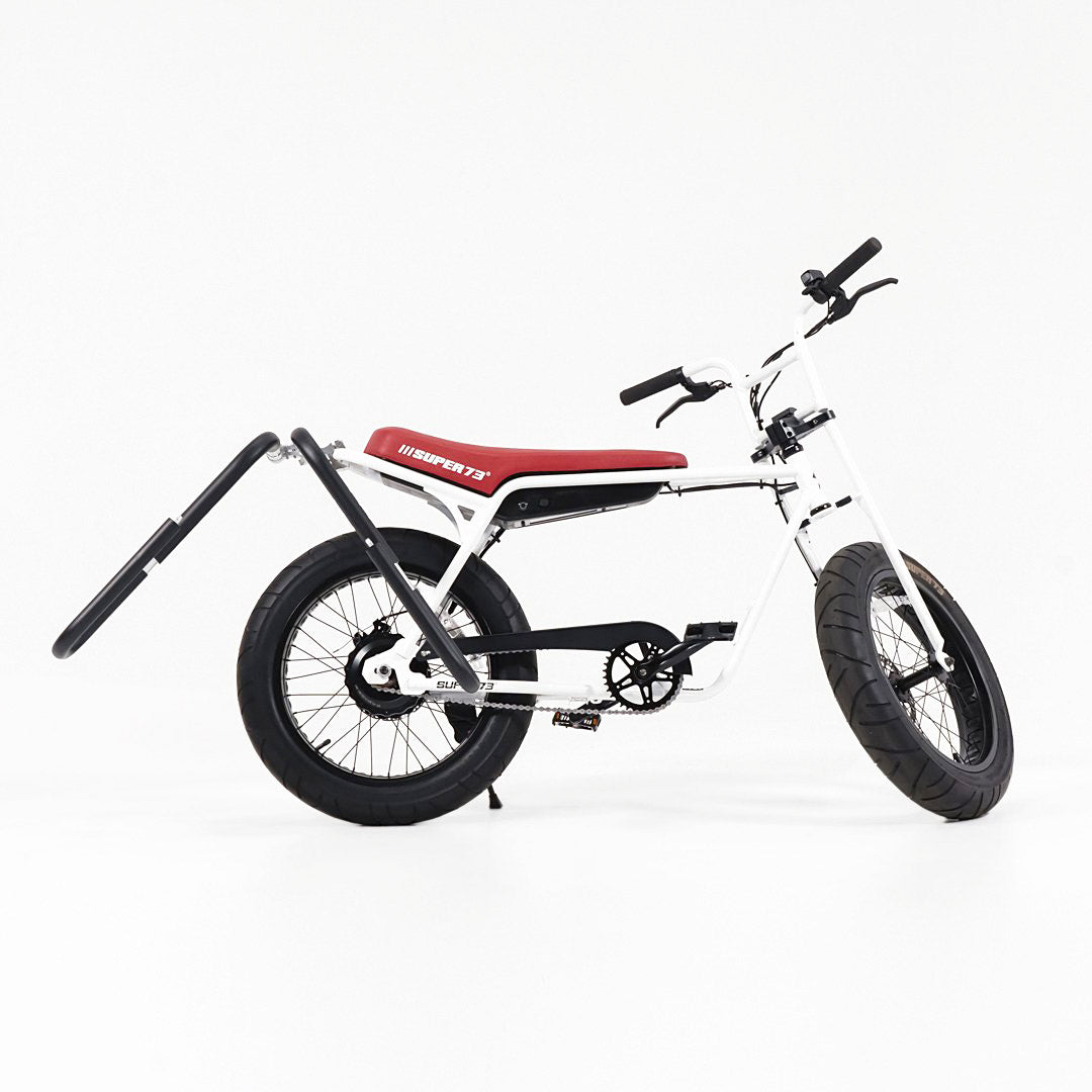 Super73 ZG carrying a surfboard with an MBB shortboard rack